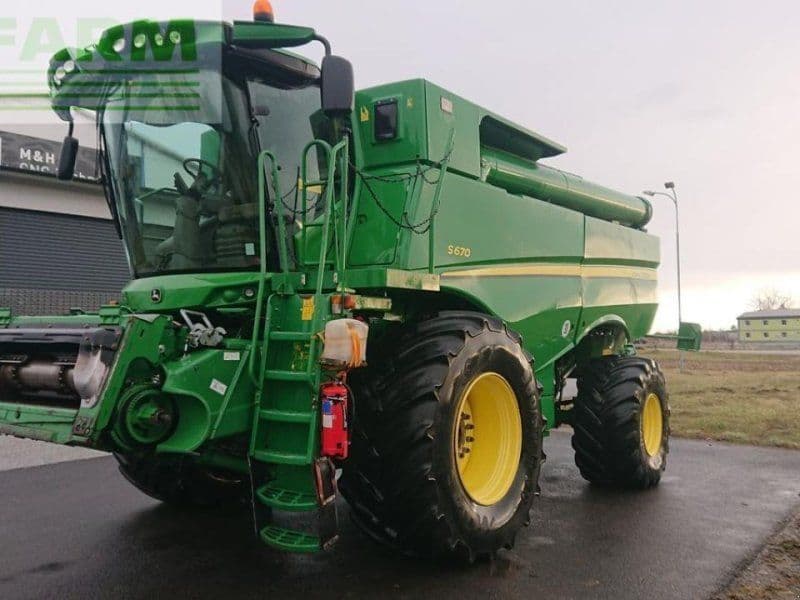 John Deere s670 4wd + macdon fd75